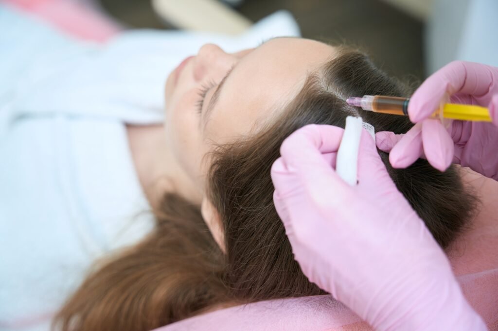Beautician makes injection in head girls for better hair growth
