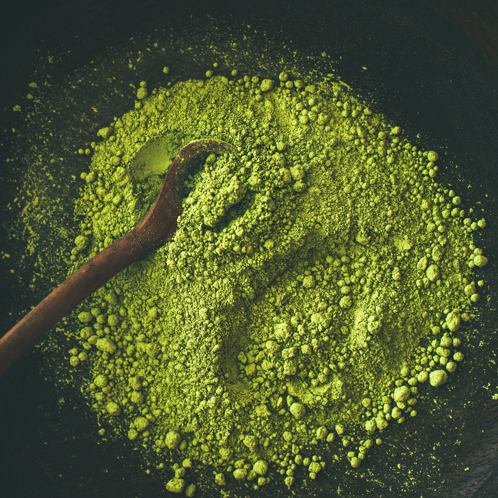 Japanese Matcha green tea powder in bowl, square crop