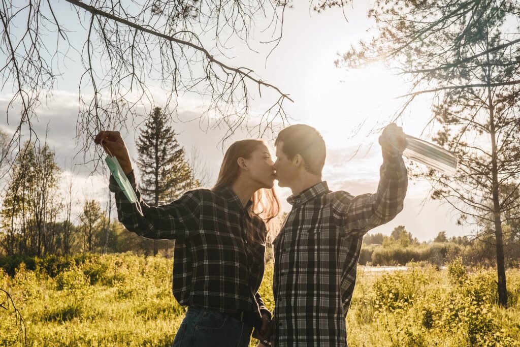Happy couple takes off protective medical mask.