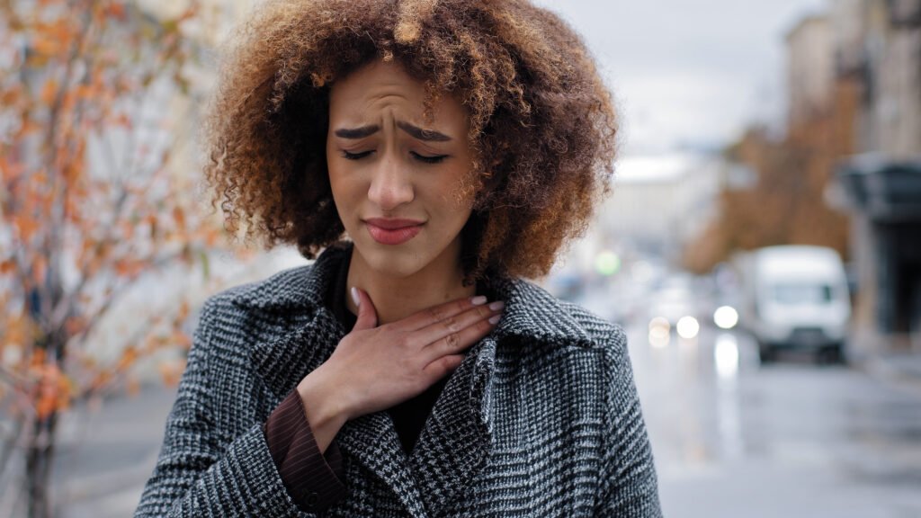Portrait african american suffering from tonsillitis angina standing outdoors portrait unhealthy