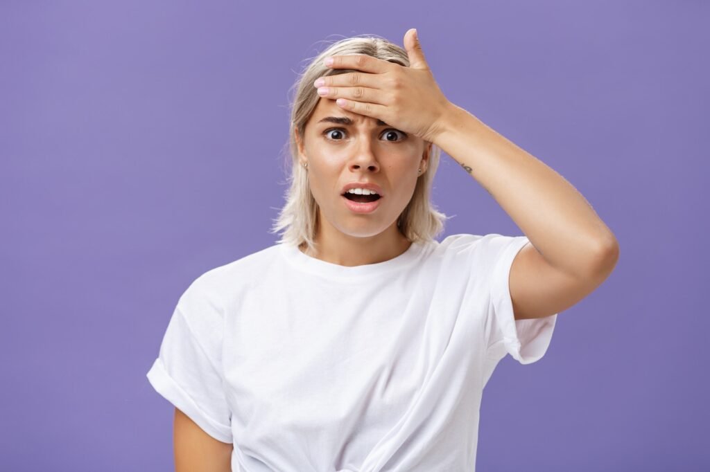 Girl totally forgot about important meeting feeling troubled. Concerned worried good-looking young