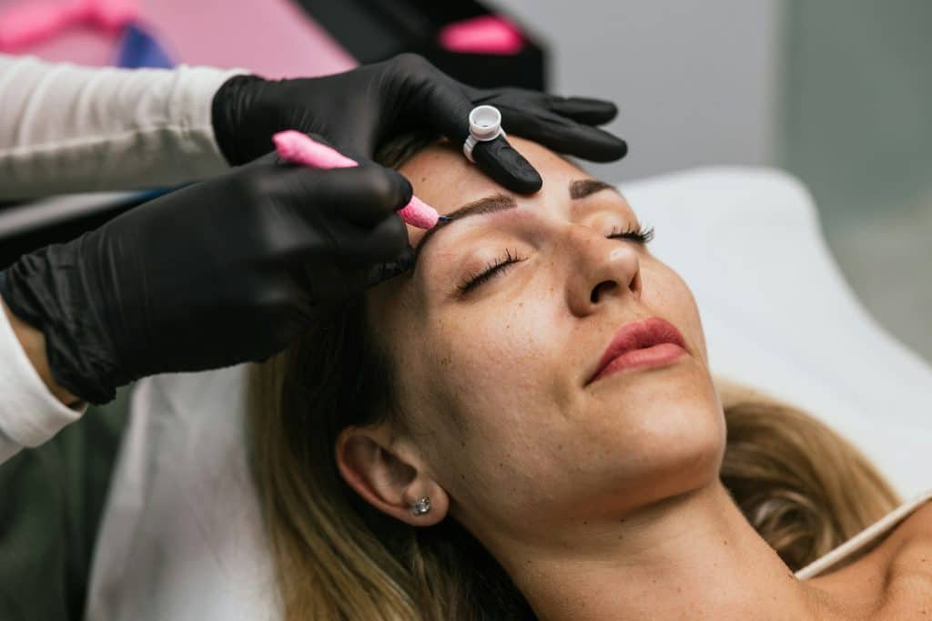 Professional microblading procedure in progress